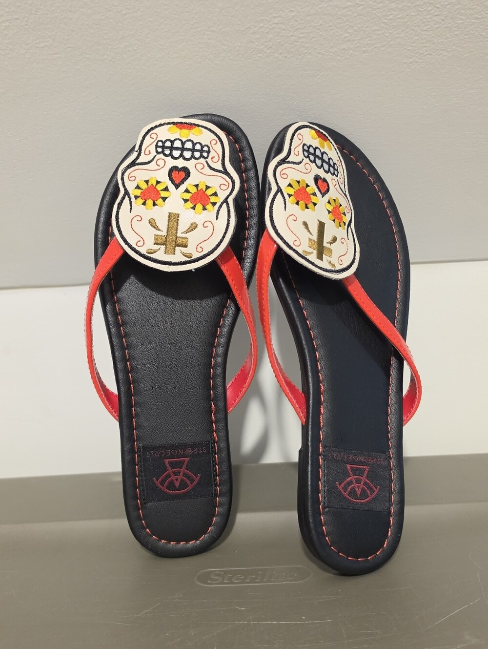 Women’s Black Sandal Flip Flops with Red Straps and Decorative Sugar Skull